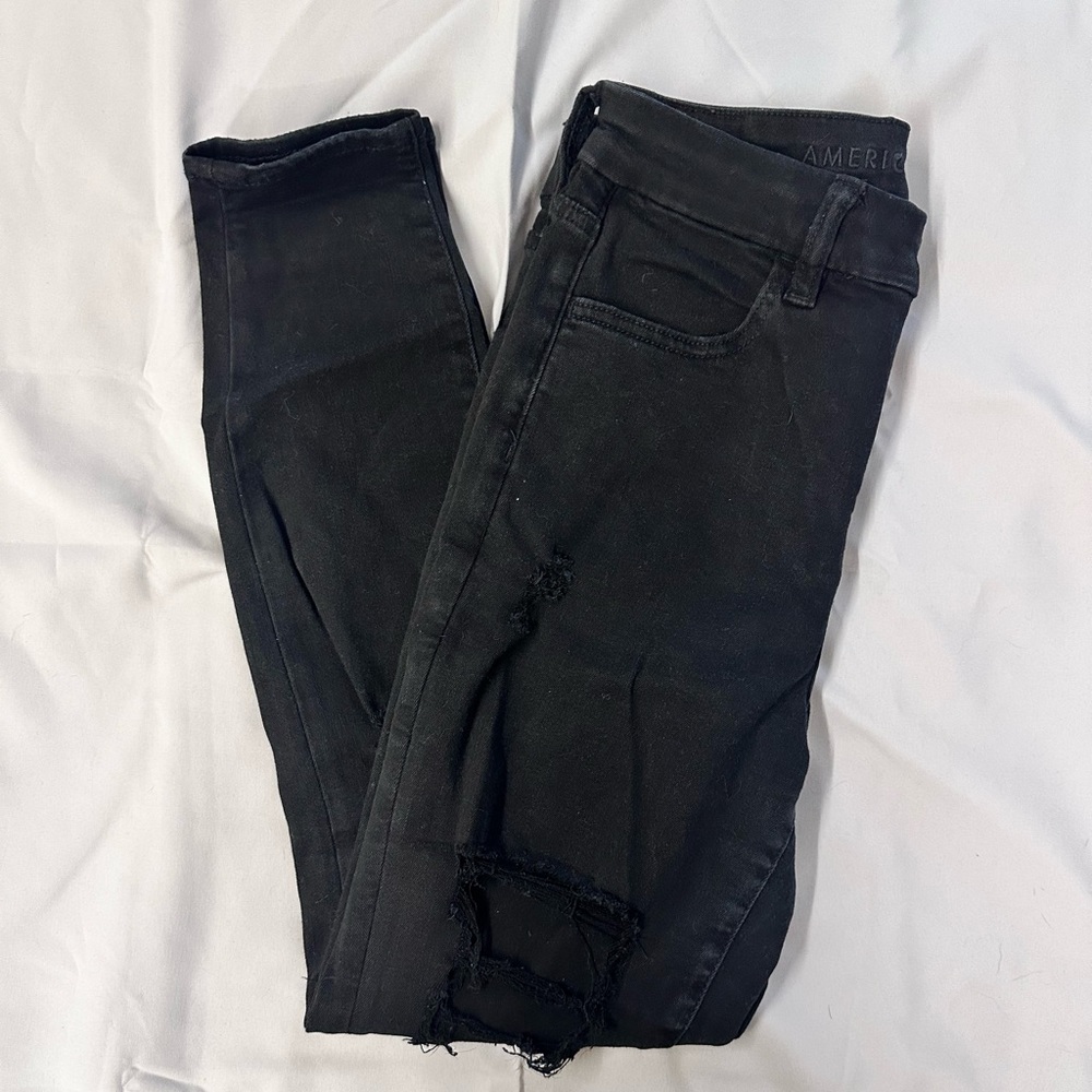 black ripped american eagle jeans